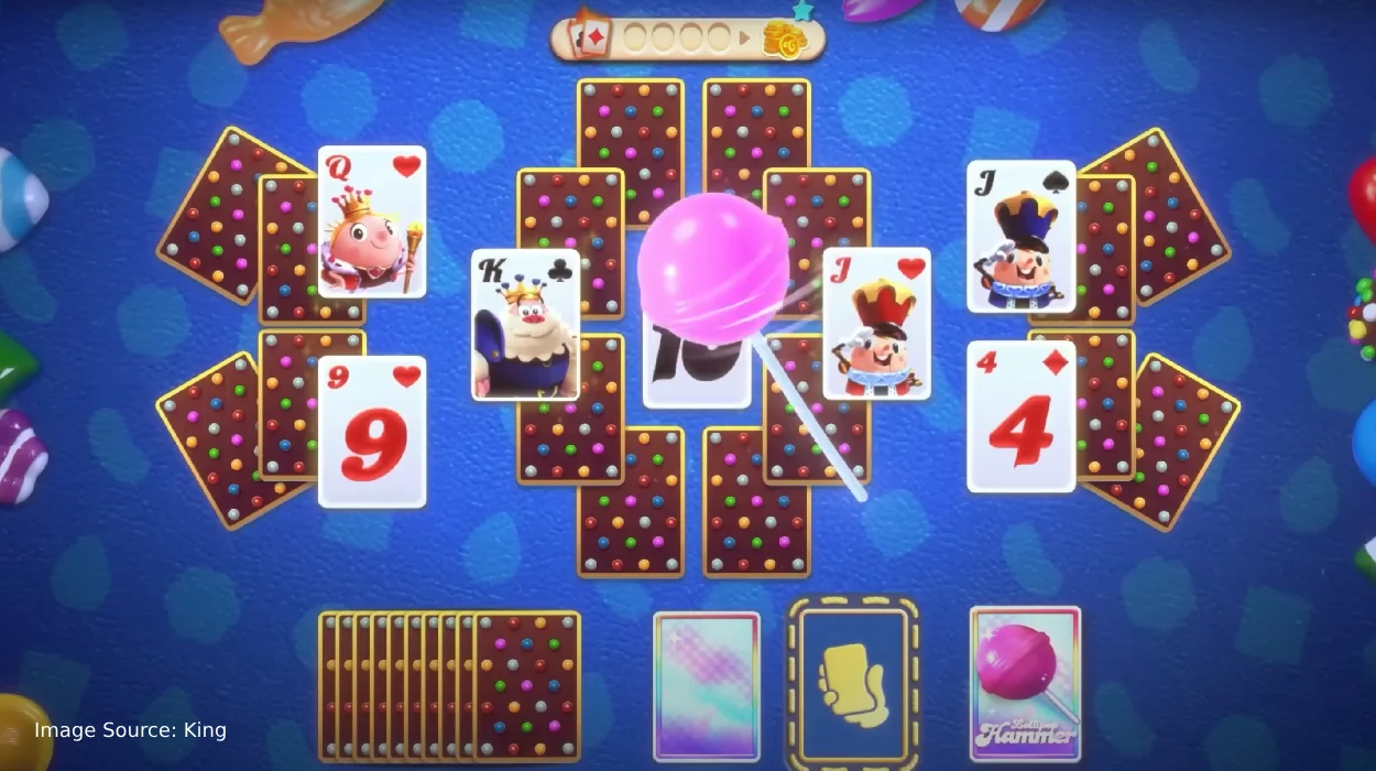 Candy Crush Solitaire gameplay showing TriPeaks cards and power-ups